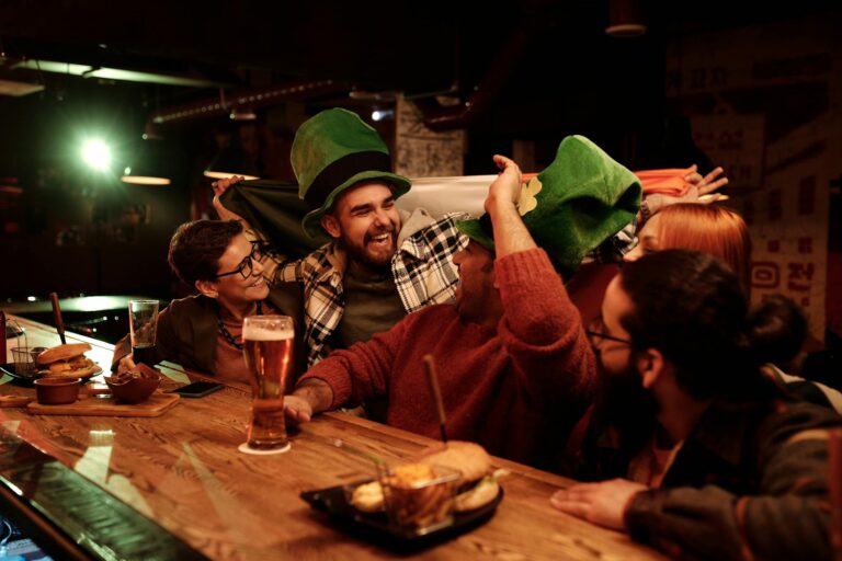 Friends celebrating St. Patrick's Day with joy and laughter at a lively bar